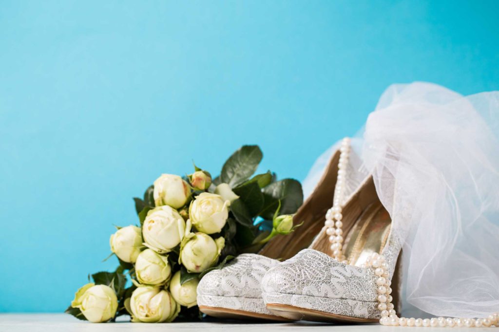 Brides shoes pearls and flowers